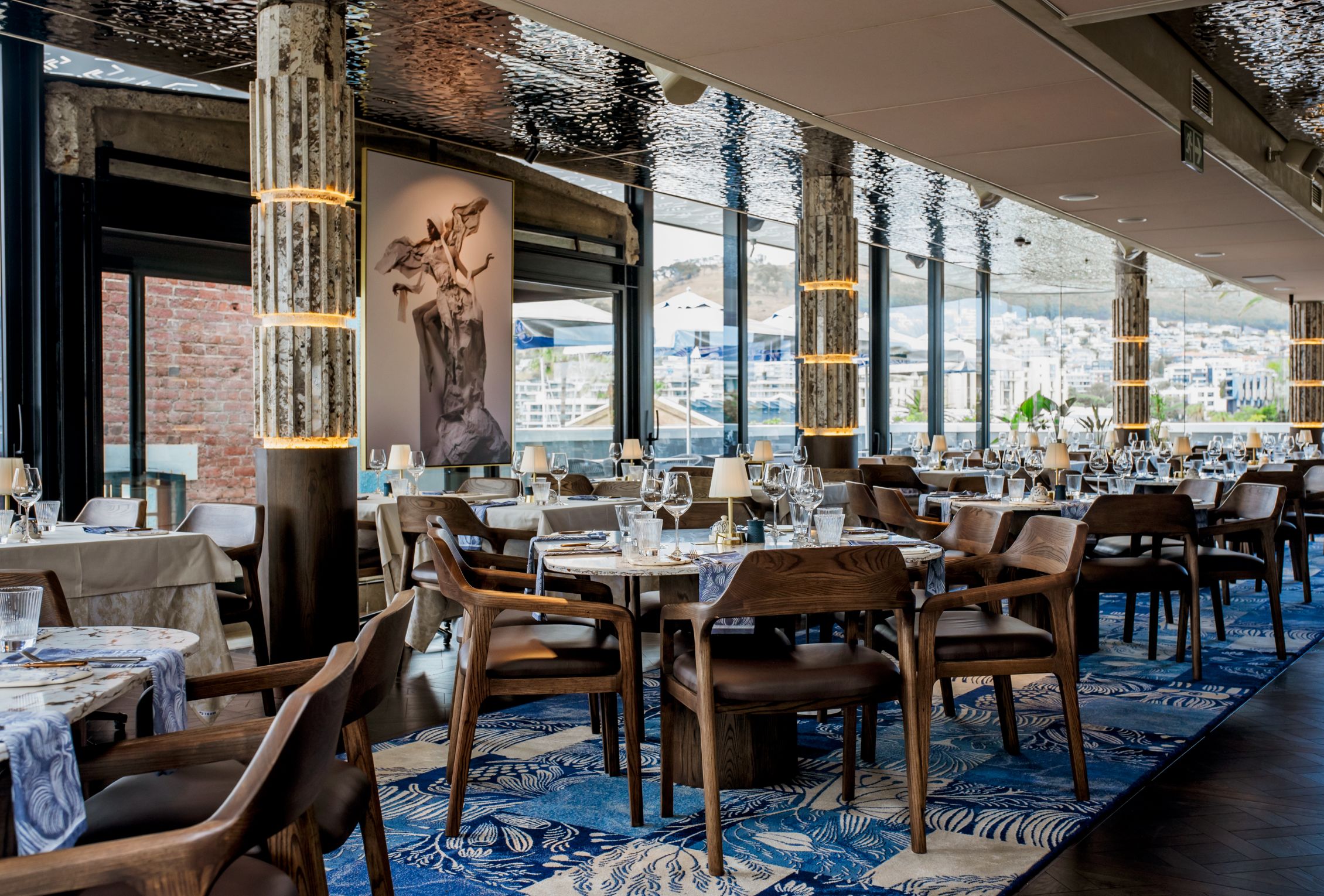V&A Waterfront dining at Marble restaurant with elegant table settings and panoramic harbor views