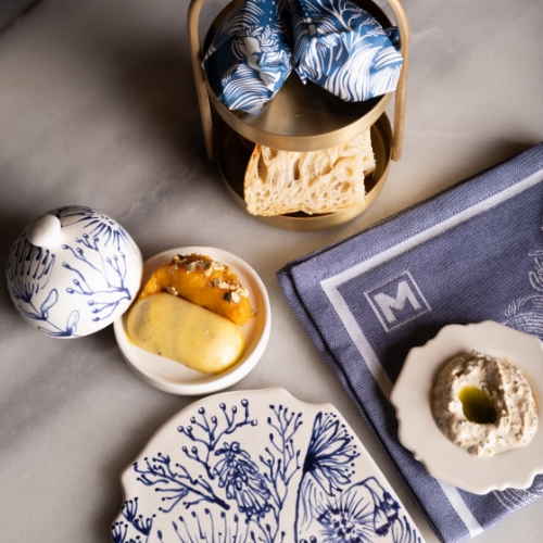 An artfully presented bread and dip service, highlighting sophisticated appetizer options from starters menu at Marble Restaurant in the V&A Waterfront